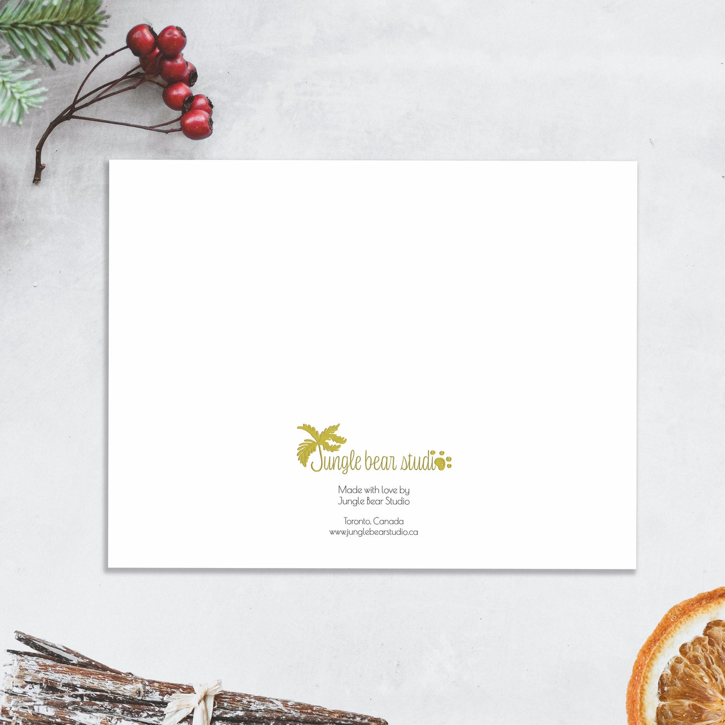 Back of the greeting card with the Jungle Bear Studio logo in gold. Small print reads, Made with love by Jungle Bear Studio. Toronto, Canada