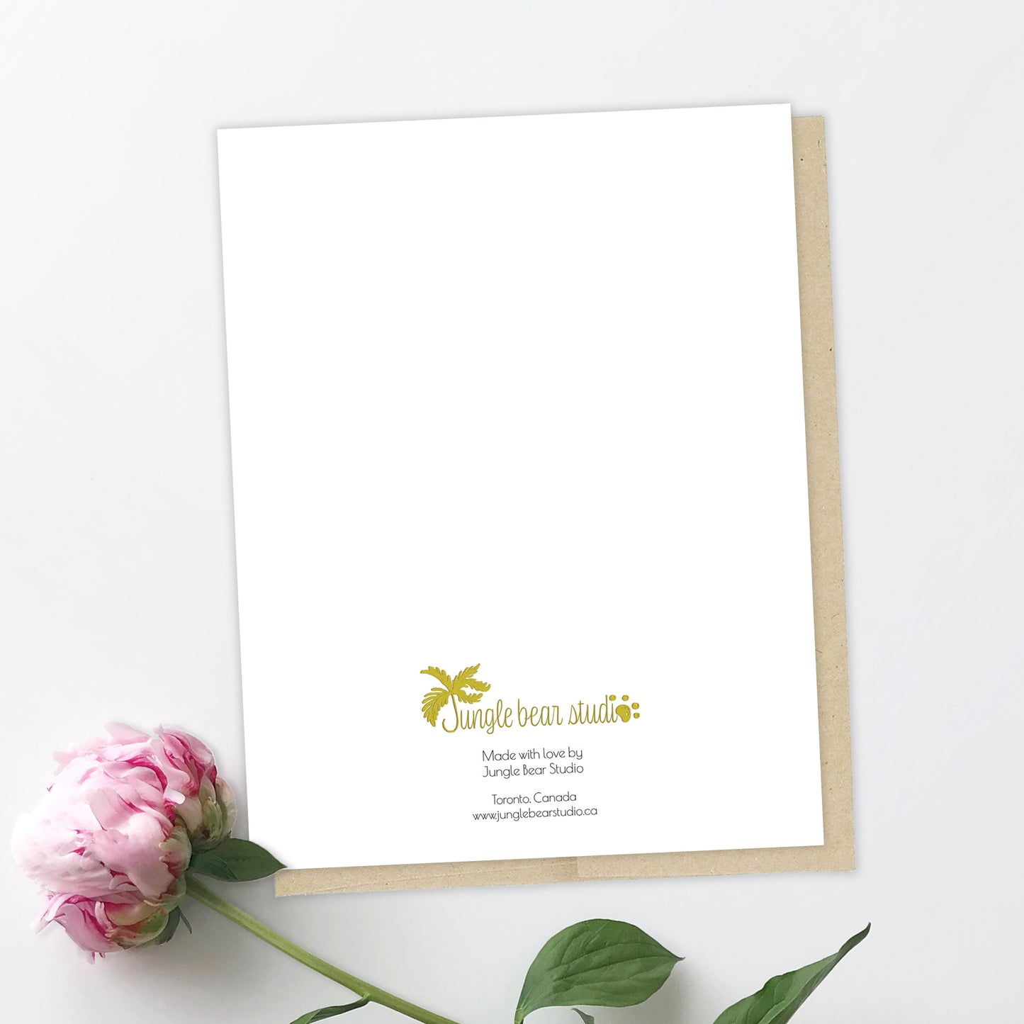 Back of the greeting card with Jungle Bear Studio's logo in gold. Below, the fine letters reads: Made with love by Jungle Bear Studio. Toronto, Canada.